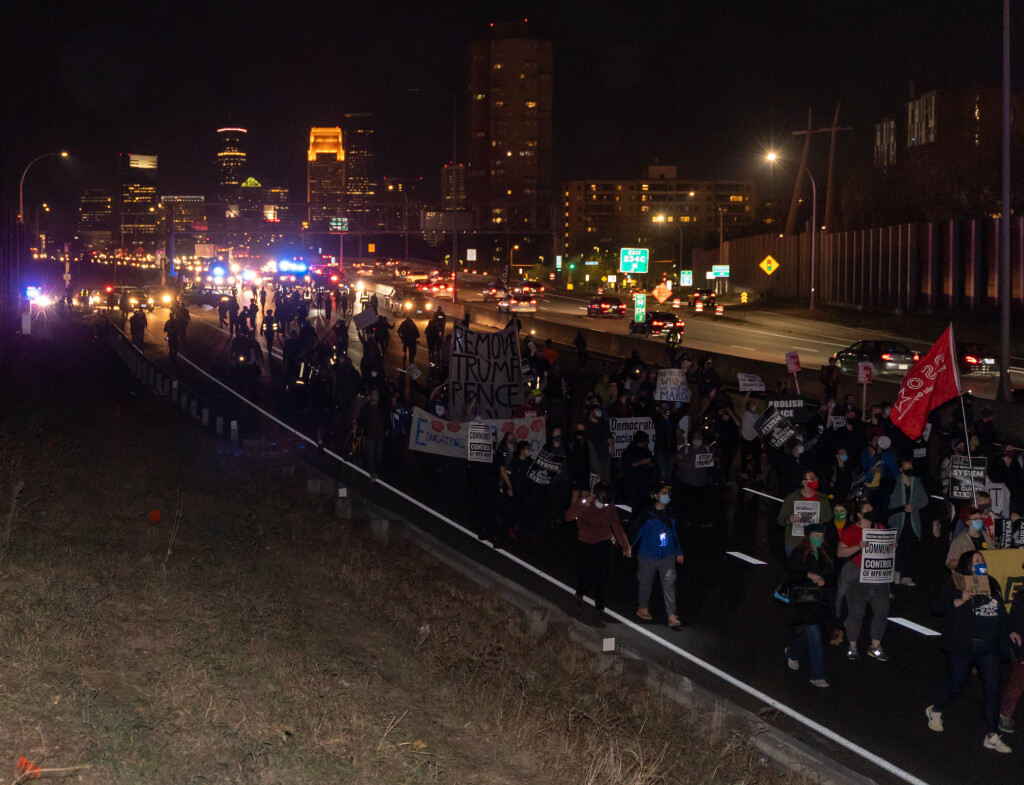 Protesters march on I-94 as police surround and trap them in a mass arrest. Photo credit: Brad Sigal